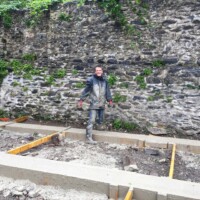 Concrete poured into the shuttering to form the pillars to build onto. Now just to level it off.