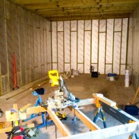 Insulating the walls inside.