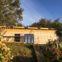 Exterior covered with housewrap - a breathable membrane for weatherproofing.