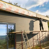 More cladding going up - the studio is starting to blend in now.